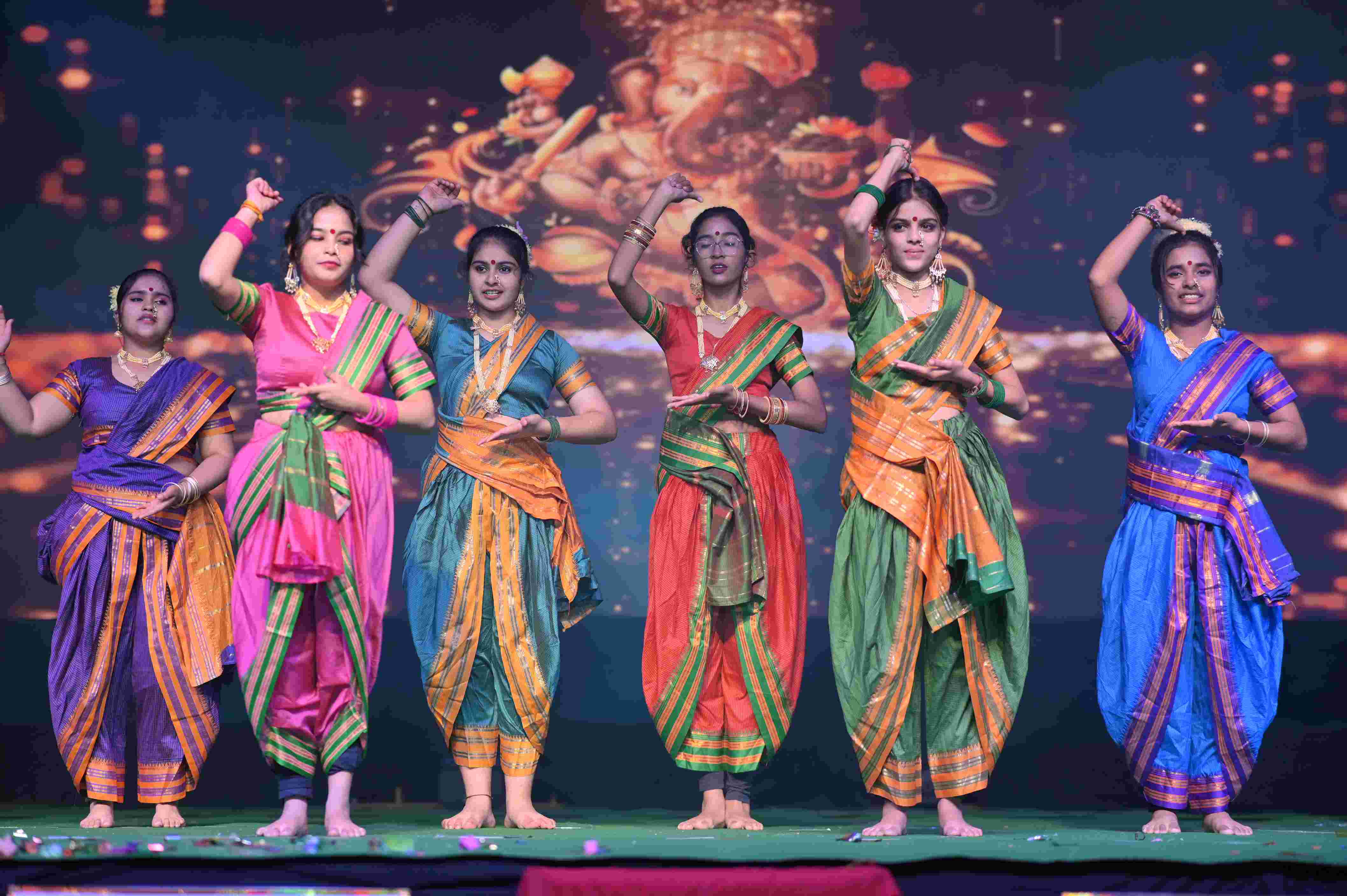 DPS Pataudi Annual Day Celebration — Students performing on stage with vibrant costumes and lively expressions